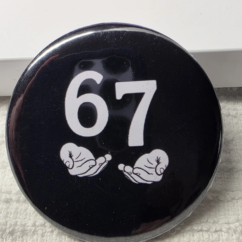 Black Button with White Number 67